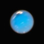 a blue object is seen in the dark sky
